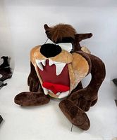 Front three-quarter view showing full plush figure