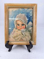 Front view of framed baby portrait print