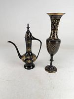 Ewer and goblet side by side showing overall forms and decoration