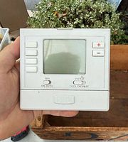 Front view of PRO thermostat showing screen and controls