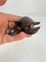 Top view of entire rosewood turtle showing shell carving