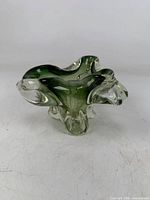 Front view showing green core and clear outer glass, freeform rim