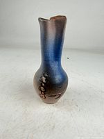 Full view of handmade pottery vase showing glaze gradient and Mount Fuji relief
