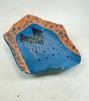 Top view showing abstract design and wavy rim