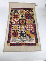 Full view of patchwork sampler wall hanging front side