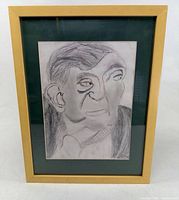 Front view of framed pencil portrait