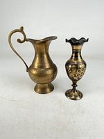overview of brass pitcher and bud vase