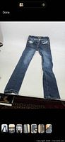 Full front view of jeans laid flat
