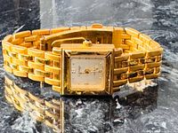 Front view of L Image gold-tone wristwatch showing dial and bracelet