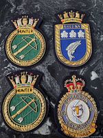 All four patches laid out on dark surface