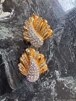 Front view pair of gold-plated rhinestone clip-on earrings