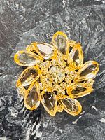 Front view of brooch showing overall design and stones