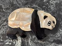 Front view of panda brooch showing full design and materials