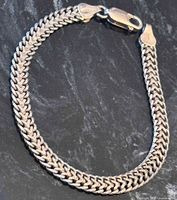 Full view of sterling wheat chain bracelet laid flat