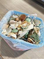 Top view of basket filled with assorted shells