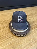 Front view of Brevard County Manatees cap figurine showing logo and base text