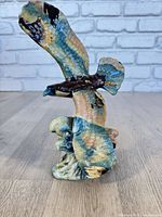 Full view of eagle sculpture with wings raised