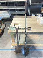 All three tools leaning against workbench for full view