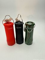 Front view of three Lightway lantern flashlights in red, black and camouflage