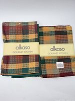 Front view showing two Alkaso Gourmet Kitchen towel sets in original bands