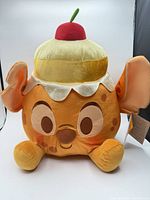 Front view of Disney Munchlings Pineapple Upside Down Cake Stitch plush