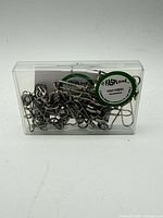 Front view of plastic case containing swivels, brand stickers visible