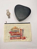 Jewelry box closed, makeup bag, watch overview