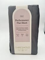 Front of packaged gray Threshold Performance flat sheet