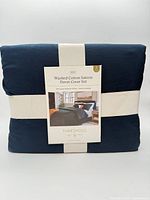 Front of packaged Threshold duvet cover set showing label