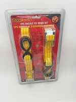 Front view of sealed package showing both yellow straps, branding and specifications