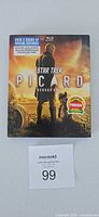 Front view of Star Trek Picard Season One Blu-ray set with slipcover and lot card 99