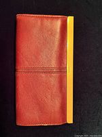 Closed wallet front view showing leather exterior