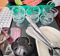 overview of lot showing dessert cups, utensils, votive holder and bakeware