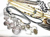 Assorted necklaces showing pendants, chains and finishes