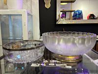 Two crystal bowls side by side on display