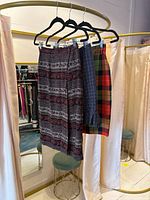 All three skirts hanging on rack
