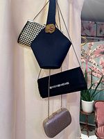Group shot of all four bags hanging to show styles, shapes and relative sizes