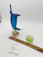 Horn sculpture and paperweight with ruler for scale