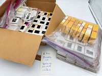 Box with multiple zip-top bags and stacks of slides; note card labeled vintage 35mm slides