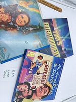 Three LaserDisc jackets: Wizard of Oz, That's Entertainment!, An American in Paris