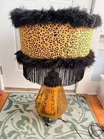 Full view of lamp showing base, shade and cord