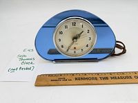 Front view showing blue mirrored body and dial