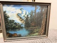 Front view of framed mountain landscape print