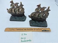 Front view of both ship bookends with ruler for scale