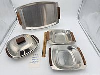 overview of all four stainless steel serveware pieces