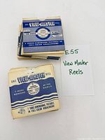 Stack of View-Master reels in sleeves beside identification card