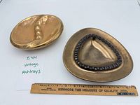 Both ashtrays next to 12 in. ruler for scale