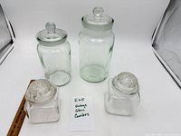 Overview of all four glass canisters with lids