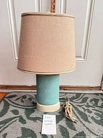 Full view of lamp showing base, shade, cord
