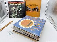 Stack of approximately 25 LPs, top album Summer-themed cartoon cover, Beethoven and Ben-Hur jackets standing behind